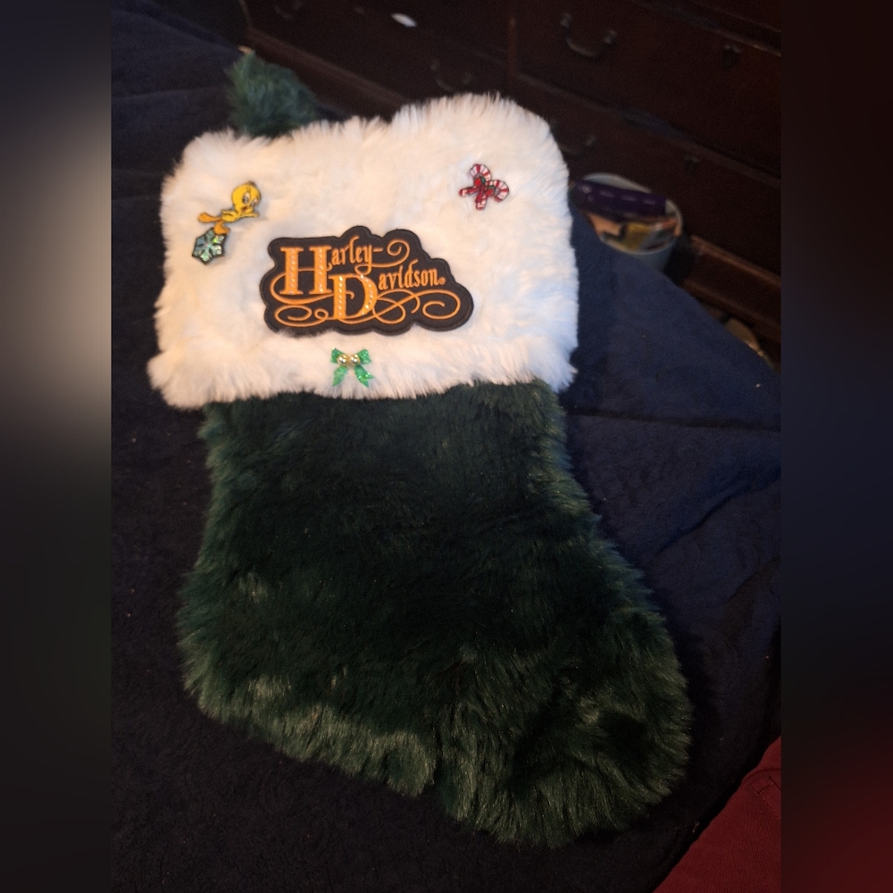 A christmas stocking with a harley logo on the front